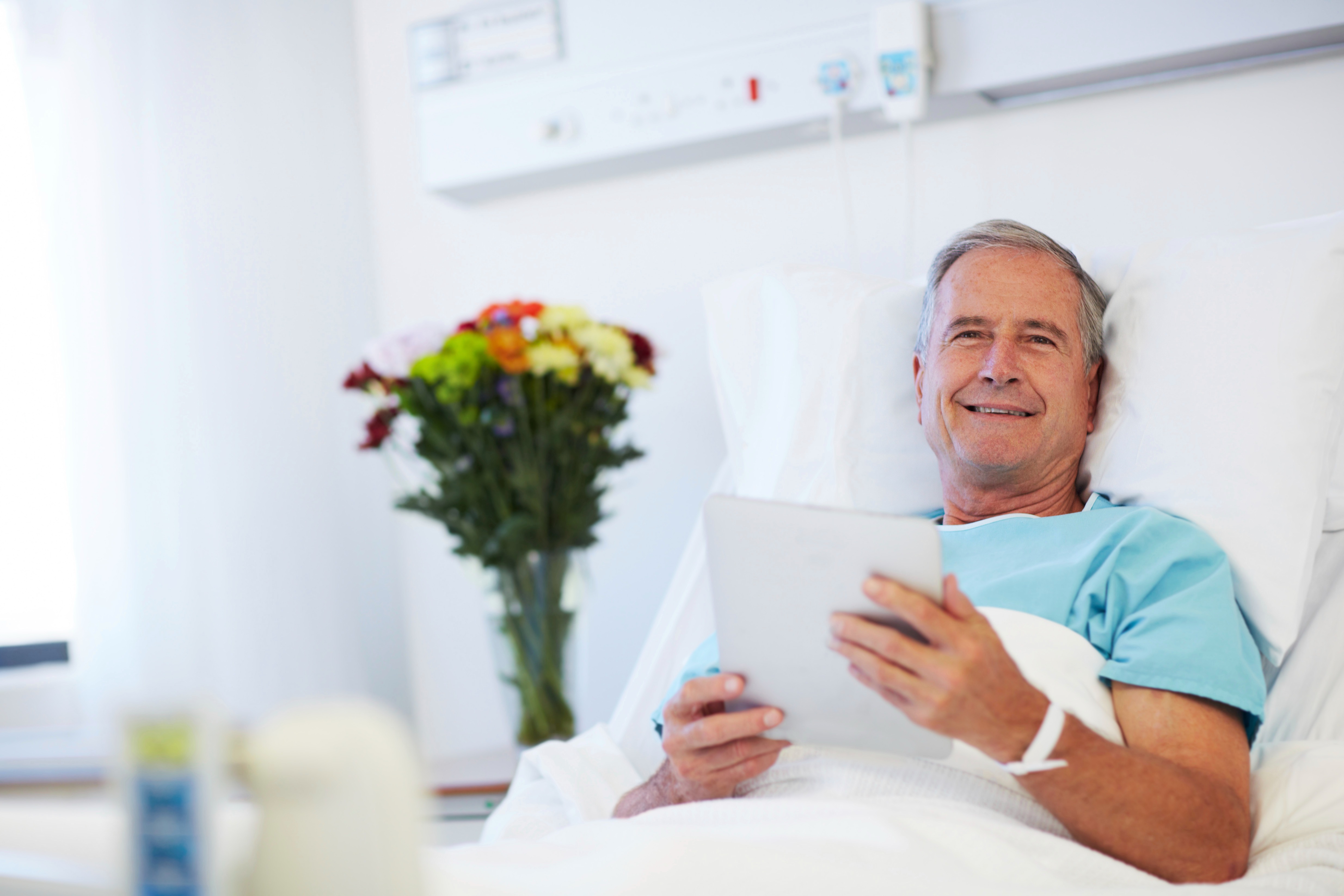 Linkvue patient entertainment system installation in modern hospital room with bedside IPTV display and nurse call integration